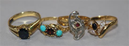A late Victorian 18ct gold and gem set ring and three other yellow metal and gem set rings including one 14ct.